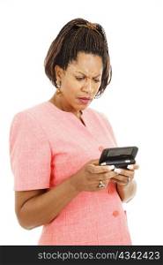 Pretty african-american businesswoman gets bad news by text. Isolated on white.