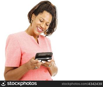 Pretty african-american woman sending a text message on her smart phone. Isolated on white.