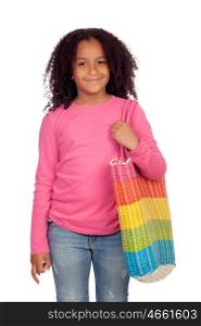 Pretty african girl with a big bag of colors isolated on white background
