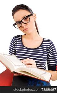pretty and young student with big funny glasses near some books