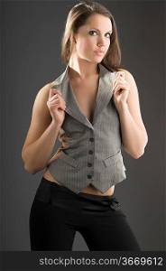 pretty and young woman with a waistcoat looking in camera