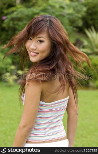 Pretty asian girl enjoying herself