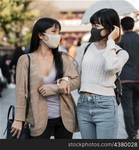 pretty asian girls wearing face masks