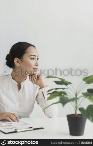 pretty asian woman sitting her workplace