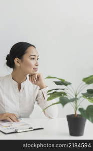 pretty asian woman sitting her workplace