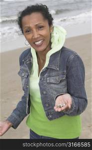 Pretty black woman showing the result of her shell search