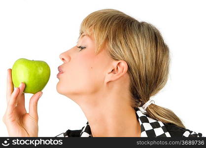 pretty blond girl kissing the green apple in her hand