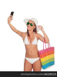 Pretty blond woman in bikini take a self portrait with her smart phone