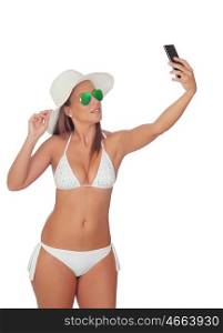 Pretty blond woman in bikini take a self portrait with her smart phone