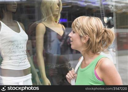 Pretty blond woman window shopping