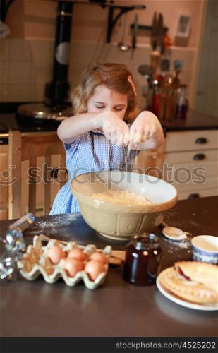 Pretty blonde girl haired mixing ingredients in a bowl