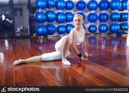 pretty blonde girl working out in fitness club