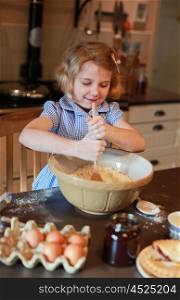 Pretty blonde haired girl mixing ingredients in a bowl for a pie