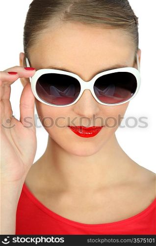 pretty blonde showing off with sunglasses