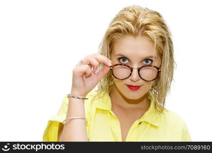 pretty blonde woman dressed in yellow with glasses on a white background