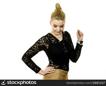 Pretty blonde woman wearing fashionable black lace top with long sleeve. Style of fashion model.. Woman wearing stylish lace top