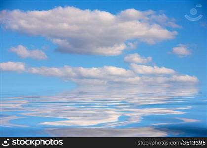 pretty blue sky reflected in the water