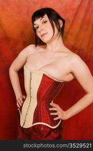 Pretty brunette dressed in a red corset