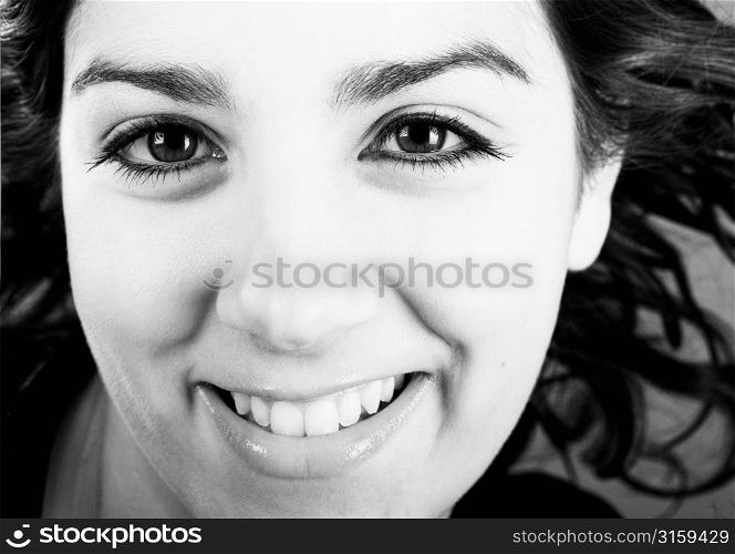 Pretty brunette girl smiling close crop