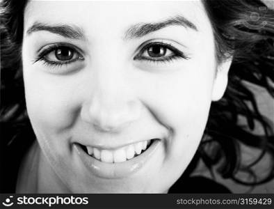 Pretty brunette girl smiling close crop