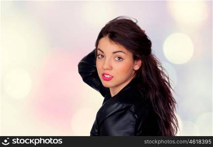 Pretty brunette girl with pink lipstick isolated on lights background