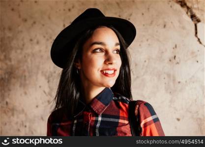 Pretty brunette girl with plaid shirt and red lips