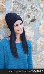 Pretty brunette girl with wool cap and piercing