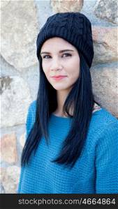 Pretty brunette girl with wool cap and piercing