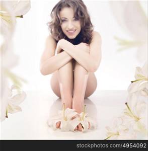 Pretty, brunette lady among white, fragrant flowers