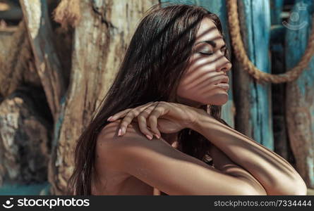 Pretty brunette lady taking a sunbath