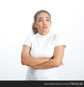 Pretty brunette looking up thoughtfully on white background