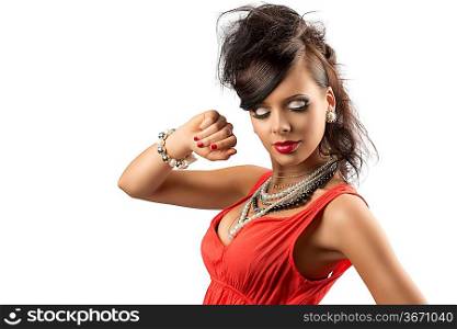 pretty brunette with fashion hair style, red dress and some necklaces. She is turned af three quarters with closed eyes, her right hand is raised near the face