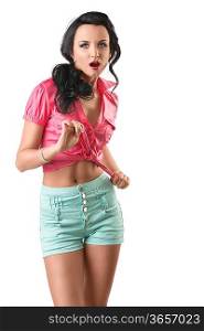 pretty brunette with green shorts and pink shirt, she looks in to the lens with open mouth and takes the node of the shirt with both hands