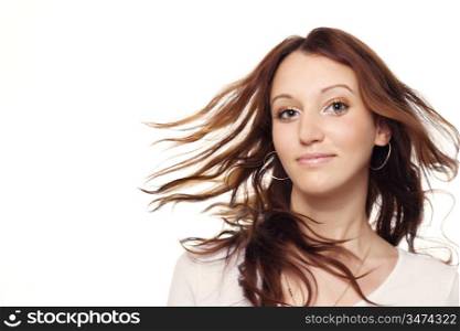 pretty brunette with her hair in motion, over white background