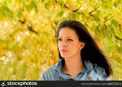 Pretty brunette woman in autumn outside