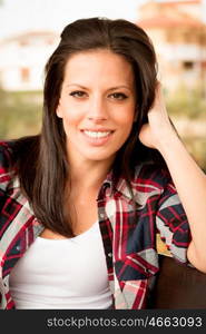 Pretty brunette woman in autumn outside