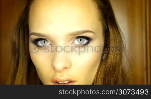 pretty brunette woman with blue eyes