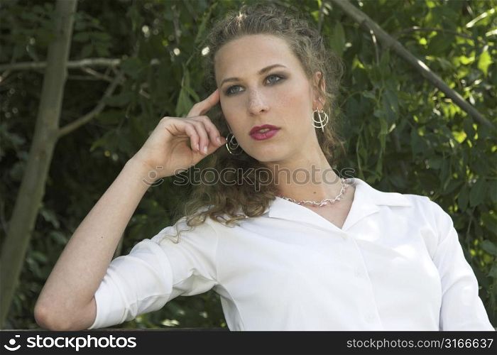 Pretty business woman relaxing in the park