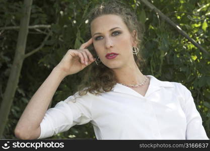 Pretty business woman relaxing in the park