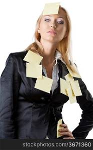 pretty business woman with black jacket and some yellow piece paper on her body, she looks in to the lens and her right hand is on the right hip