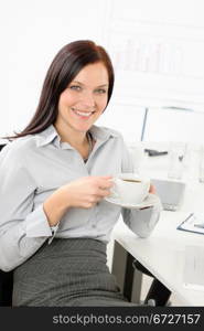 Pretty businesswoman drink coffee at modern office enjoy break