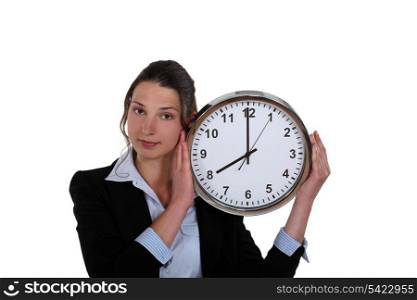 pretty businesswoman holding clock