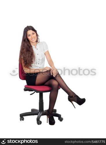 Pretty businesswoman in a stylish miniskirt sitting isolated on white