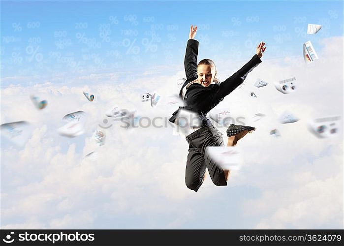 pretty businesswoman jumping high against diagram background