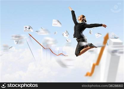 pretty businesswoman jumping high against diagram background