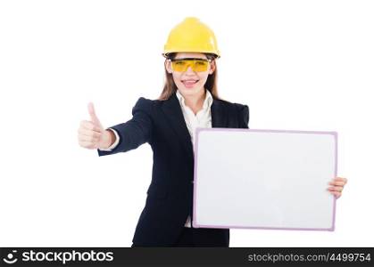 Pretty businesswoman with hard hat and blank board isolated on white