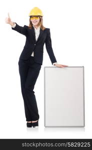 Pretty businesswoman with hard hat and blank board isolated on white