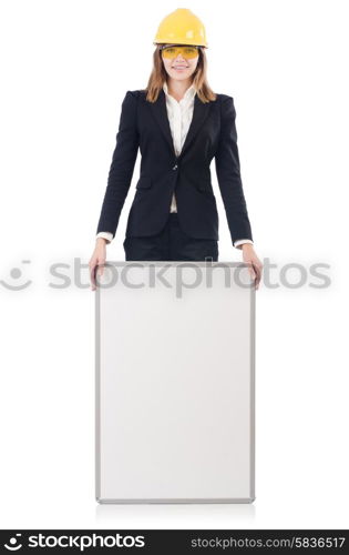 Pretty businesswoman with hard hat and blank board isolated on white