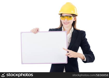 Pretty businesswoman with hard hat and blank board isolated on white