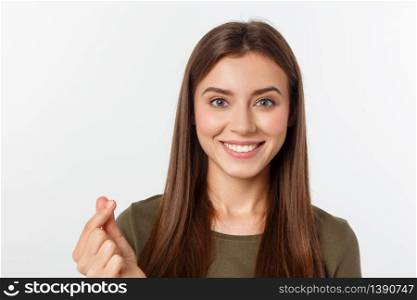 Pretty caucaisan female teenager standing and smiling over white background.. Pretty caucaisan female teenager standing and smiling over white background